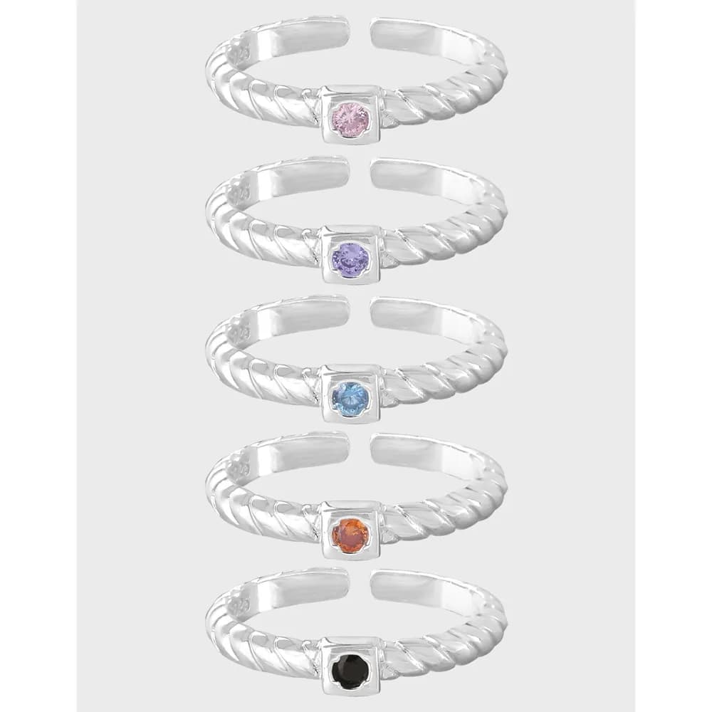 Row of six sterling silver twisted rope rings with square bezel settings and colorful central stones.