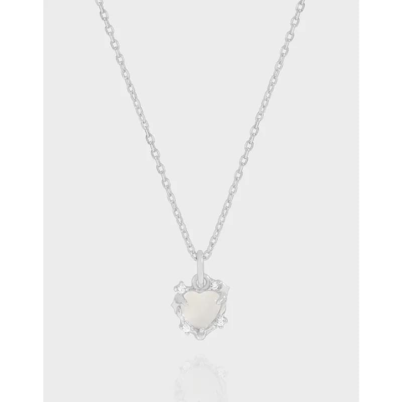 Sterling silver necklace with a heart-shaped pearl pendant hanging from a delicate chain.