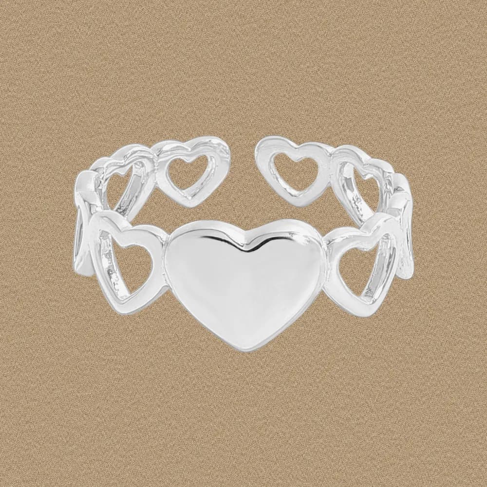 Polished sterling silver ring with a central heart and surrounding open-heart links