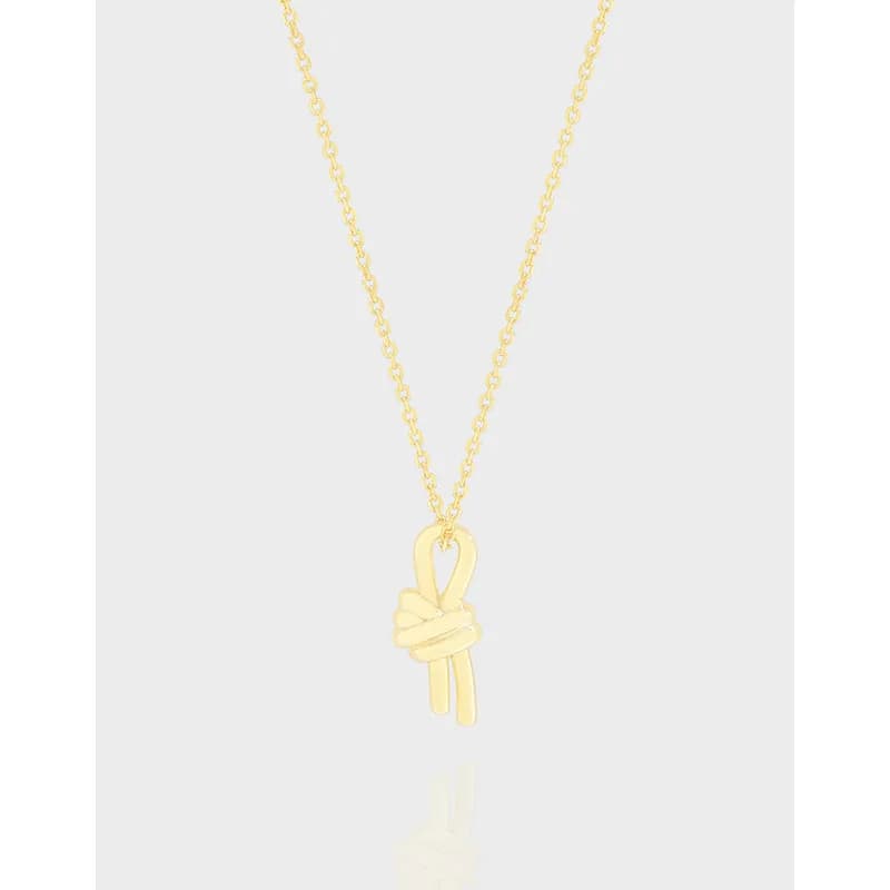 Polished sterling silver necklace with a small knot ribbon pendant on a delicate chain