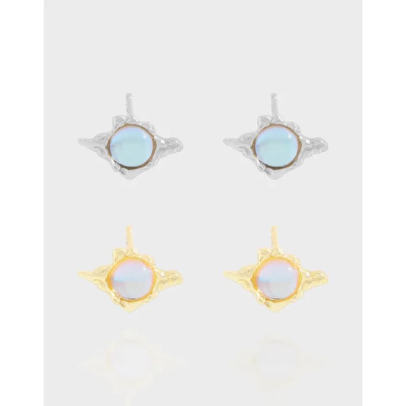 Pair of wing-shaped opal stud earrings in silver and gold-tone finishes.