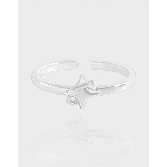 Open-band ring in polished sterling silver with a small raised star charm