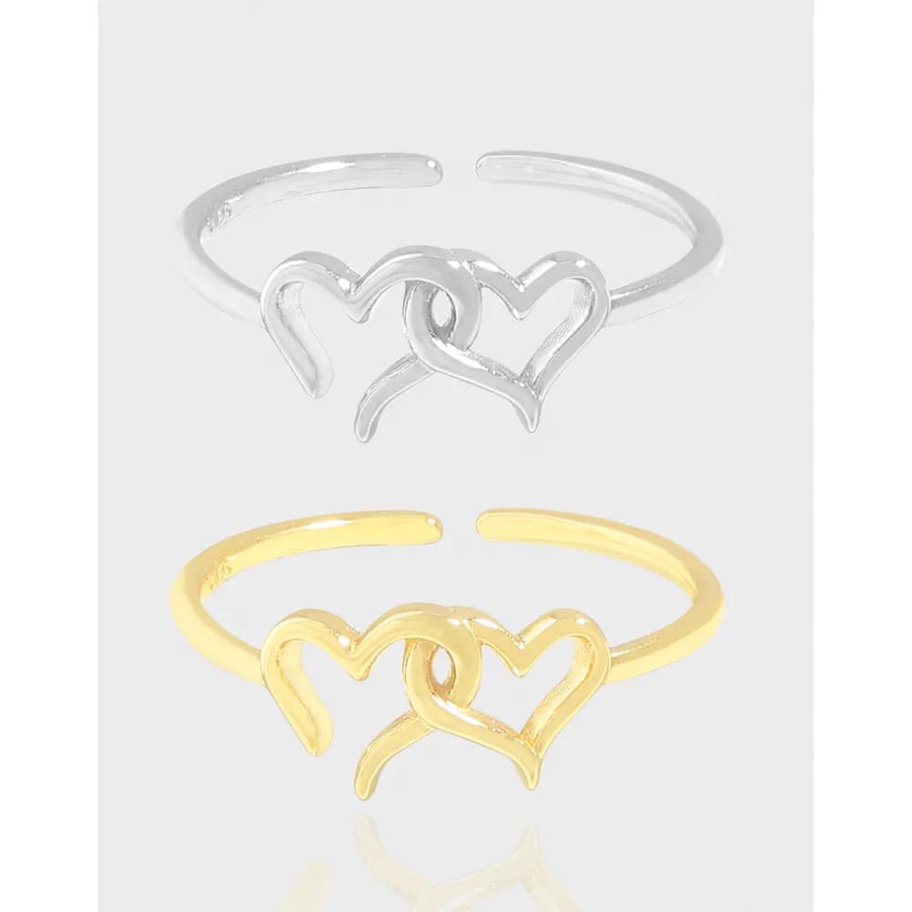 Open-ended ring with two intertwining hearts in silver and gold finishes