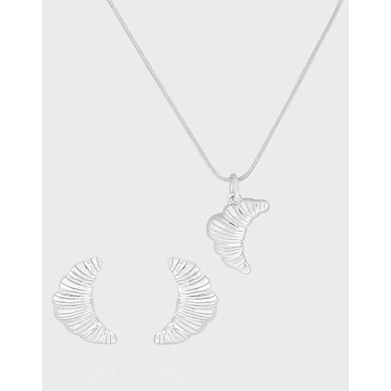 Polished sterling silver crescent pendant on a fine chain with matching ribbed crescent earrings
