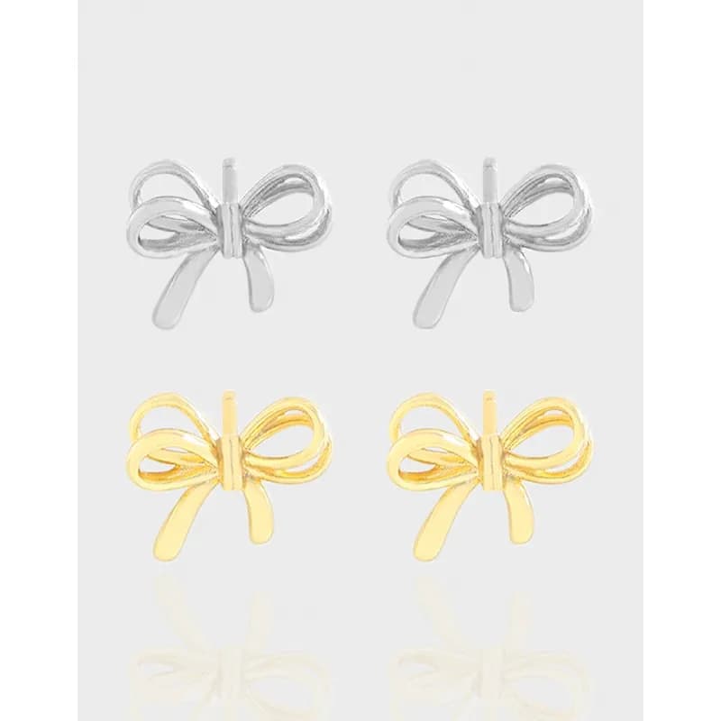 Bow-shaped sterling silver earrings with a polished finish and bow motif