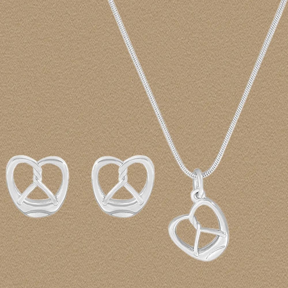 Polished sterling silver open-heart pendant on a delicate chain with matching heart earrings