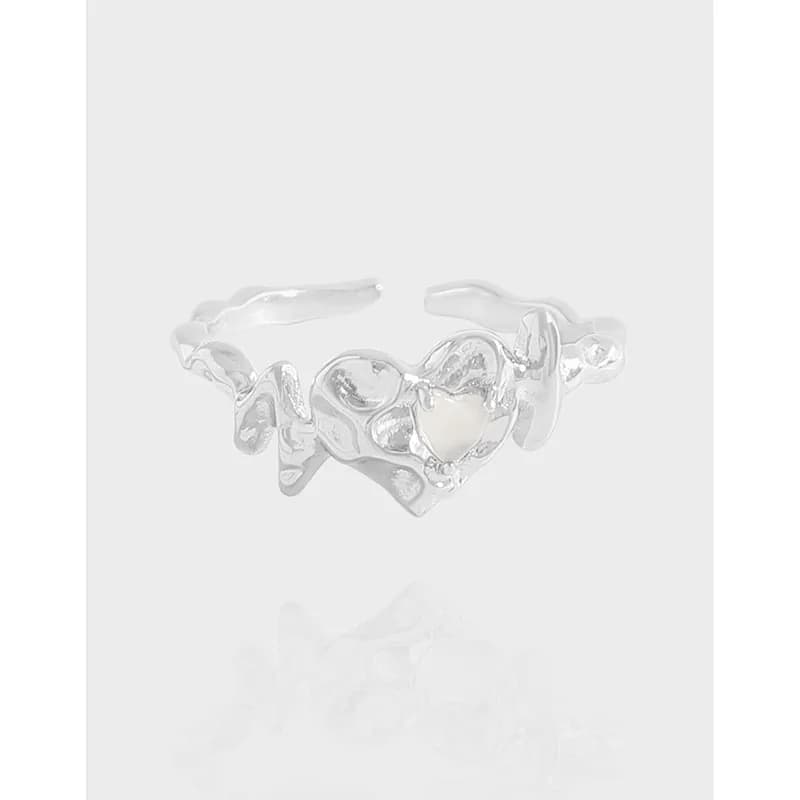 Polished sterling silver ring with an organic, freeform sculptural silhouette.