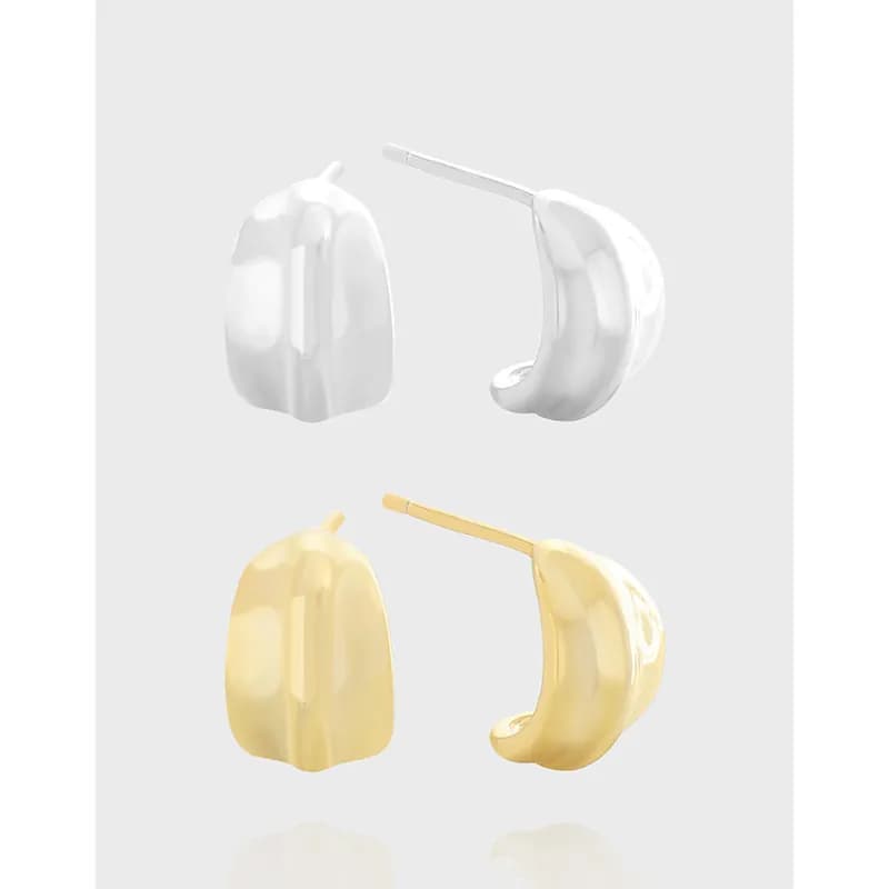 Polished curved pebble-shaped earrings in silver and gold-tone colors displayed side by side.