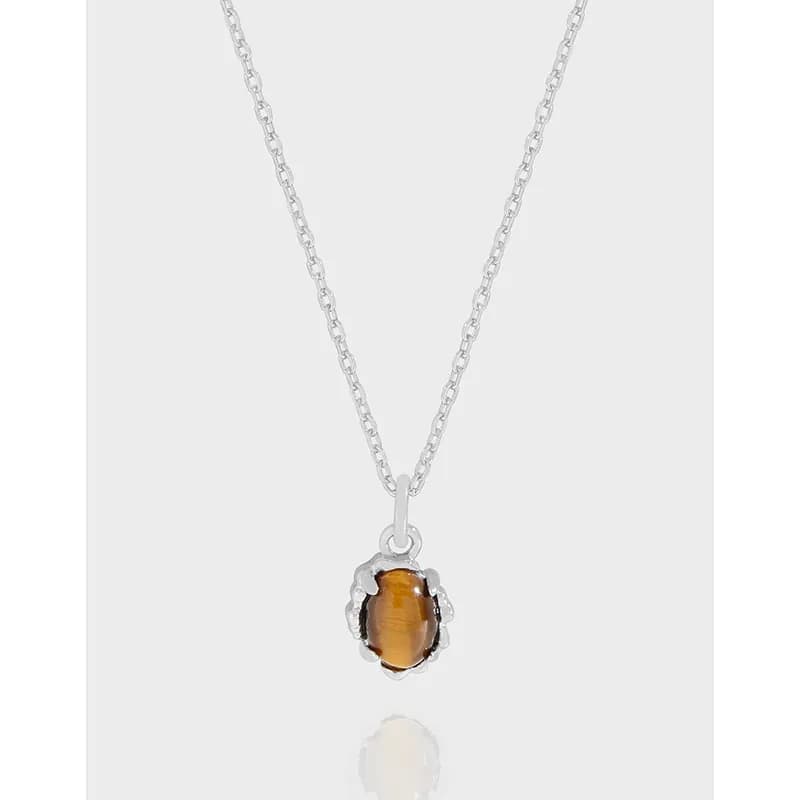 Sterling silver chain with a tiger eye pendant in a scalloped bezel