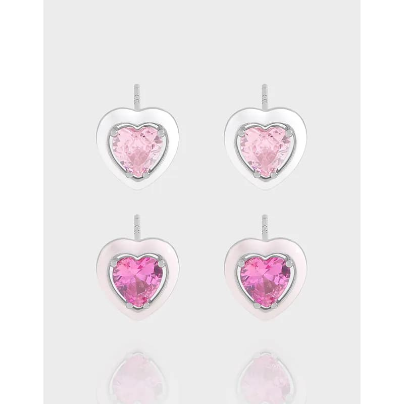 Heart-shaped pink gemstone studs in polished sterling silver with outer heart frame