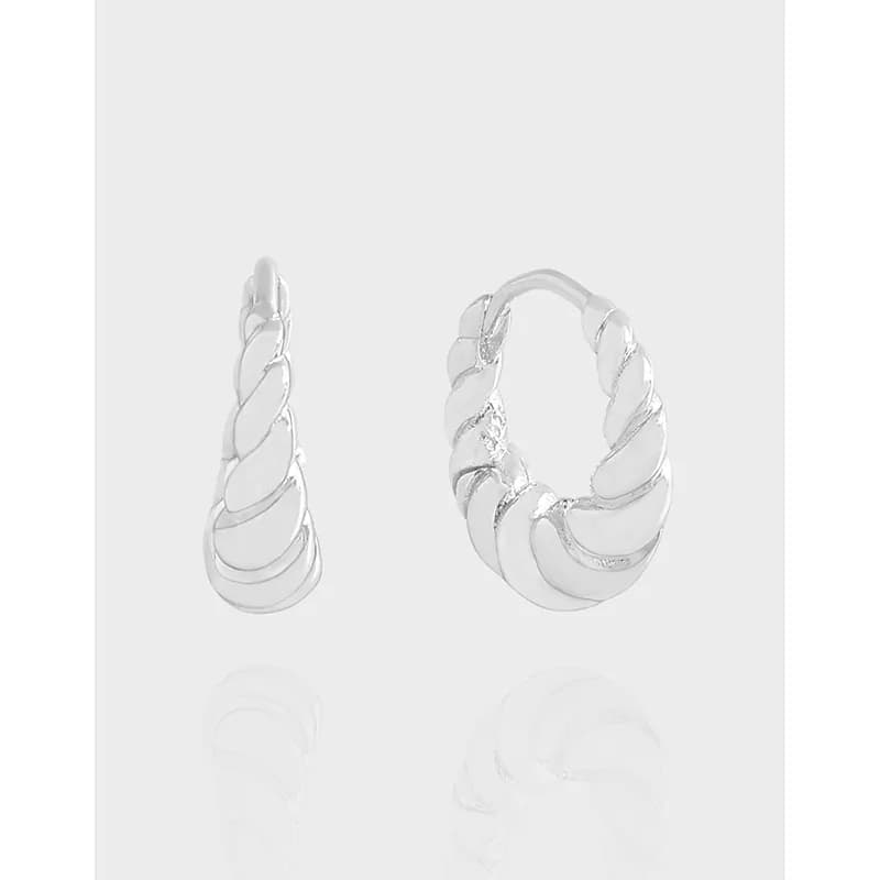 Polished silver twisted rope hoop earrings on a white background.