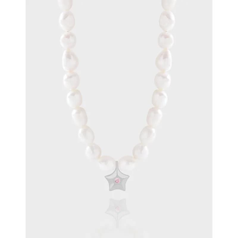 Pearl necklace with a star-shaped silver pendant featuring a pink gemstone at the center