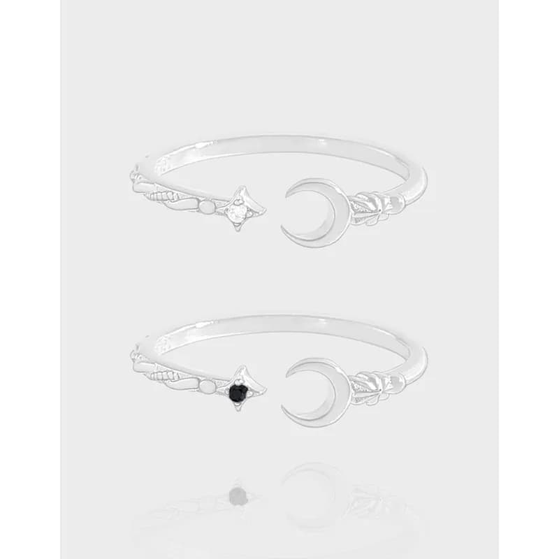 Polished sterling silver open-ring with a crescent moon motif and botanical end details