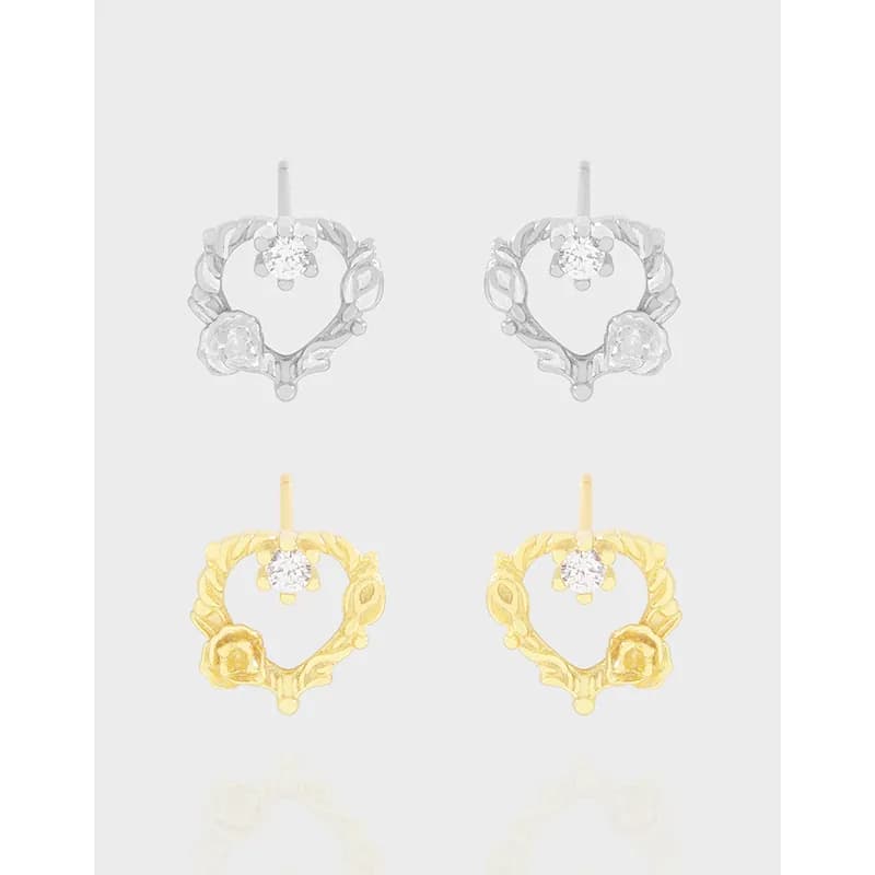 Polished heart wreath hoop earrings in silver and gold finishes with floral detailing and a small top post.