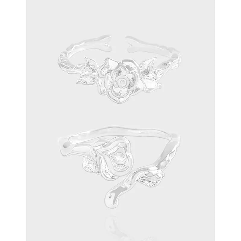 Polished sterling silver rose ring with detailed blossom and leaf accents shown from front and side.