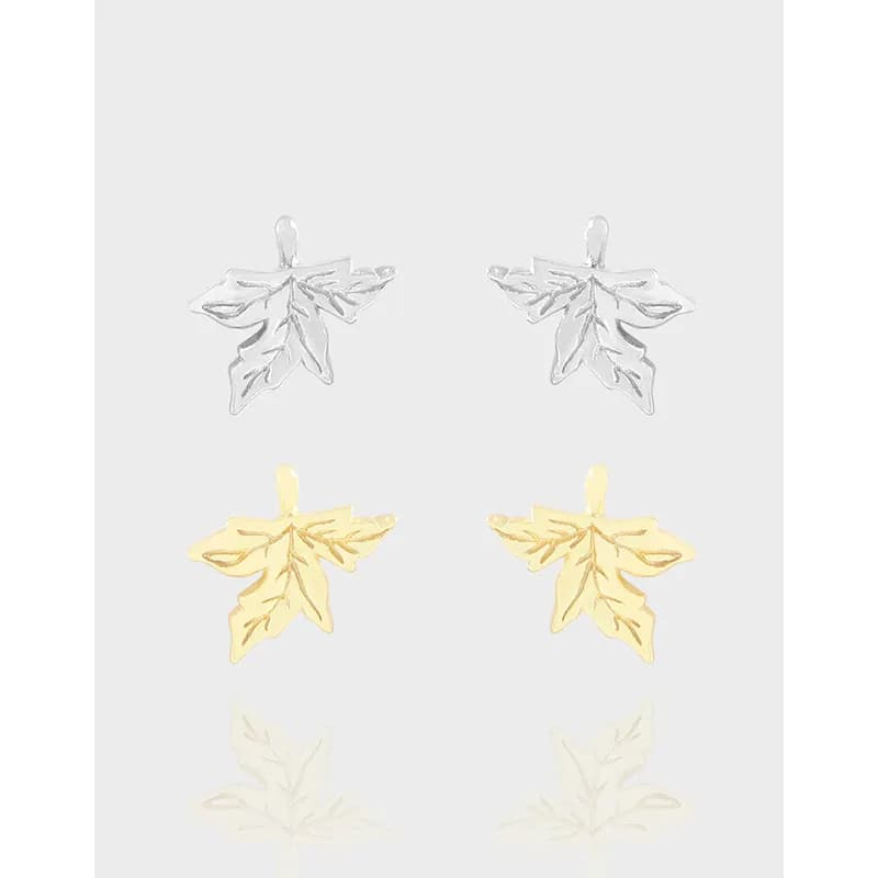Polished two-tone leaf cluster earrings in a nature-inspired design.