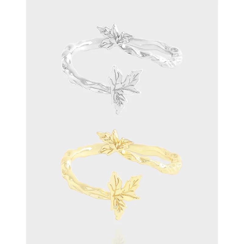 Polished silver leaf-wrapped ring with a delicate vine texture and leaf ends.