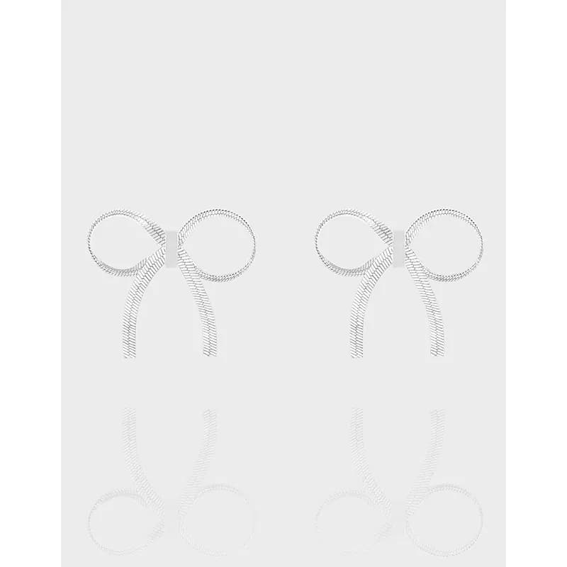 Two sterling silver bow-shaped hoops with textured rope edges sit side by side against a light gray background.