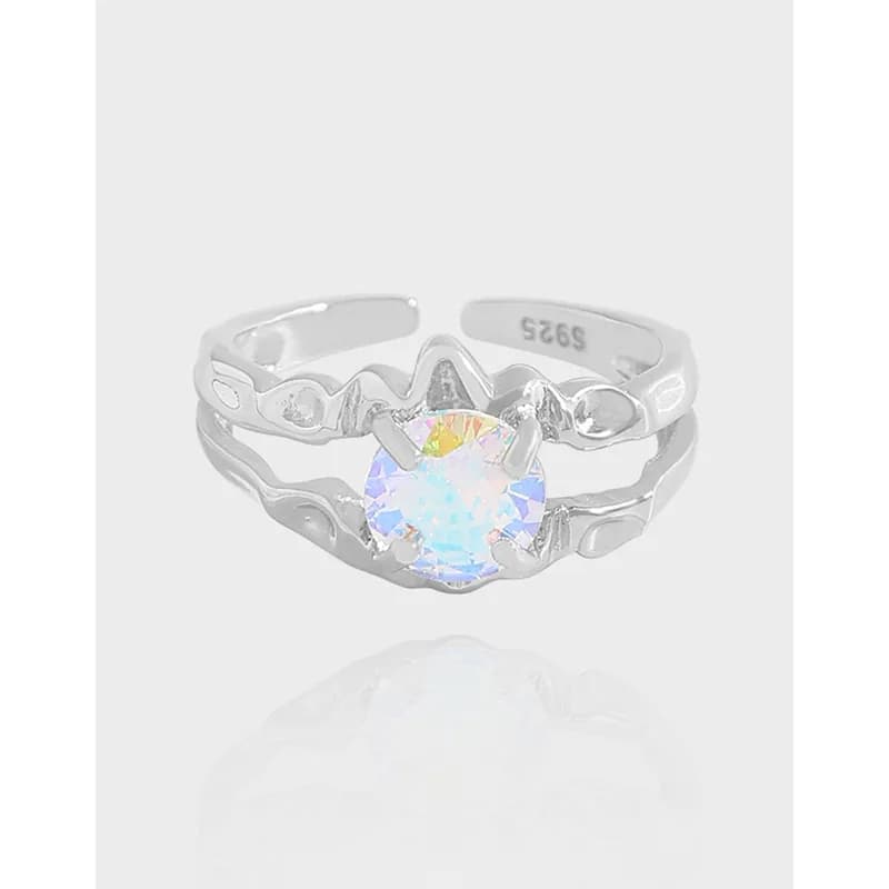 Polished sterling silver ring with a central iridescent round gemstone set in a wavy split-band design.
