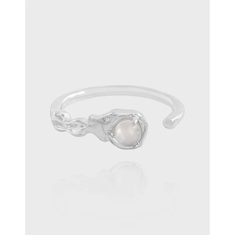 Polished sterling silver open-band ring with a dragon head wrapping around a pearl centerpiece