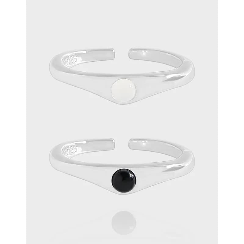 Polished sterling silver open cuff ring with a circular front bezel dot in white and black
