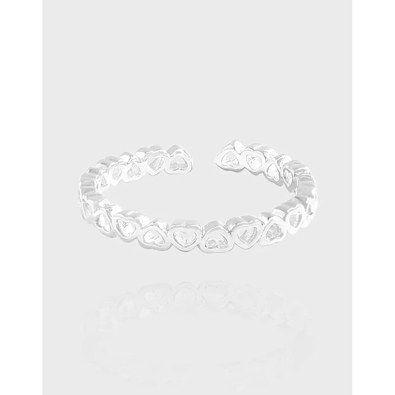 Polished sterling silver heart-link ring displayed as an open adjustable band.