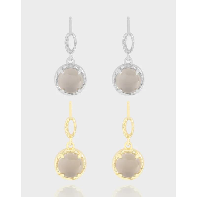 Two-tone circle-bezel drop earrings with textured oval links and taupe cabochon stones.