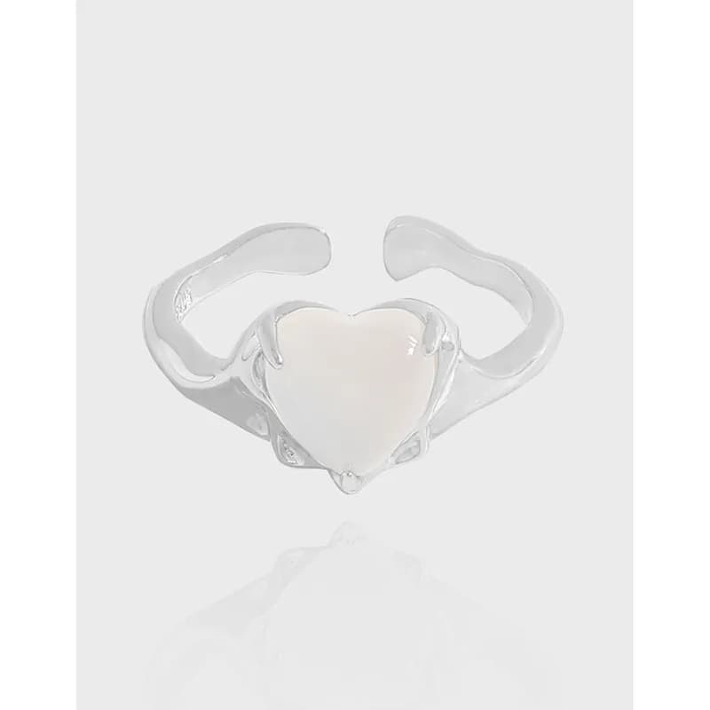 Sterling silver open ring with a heart-shaped milky stone centerpiece