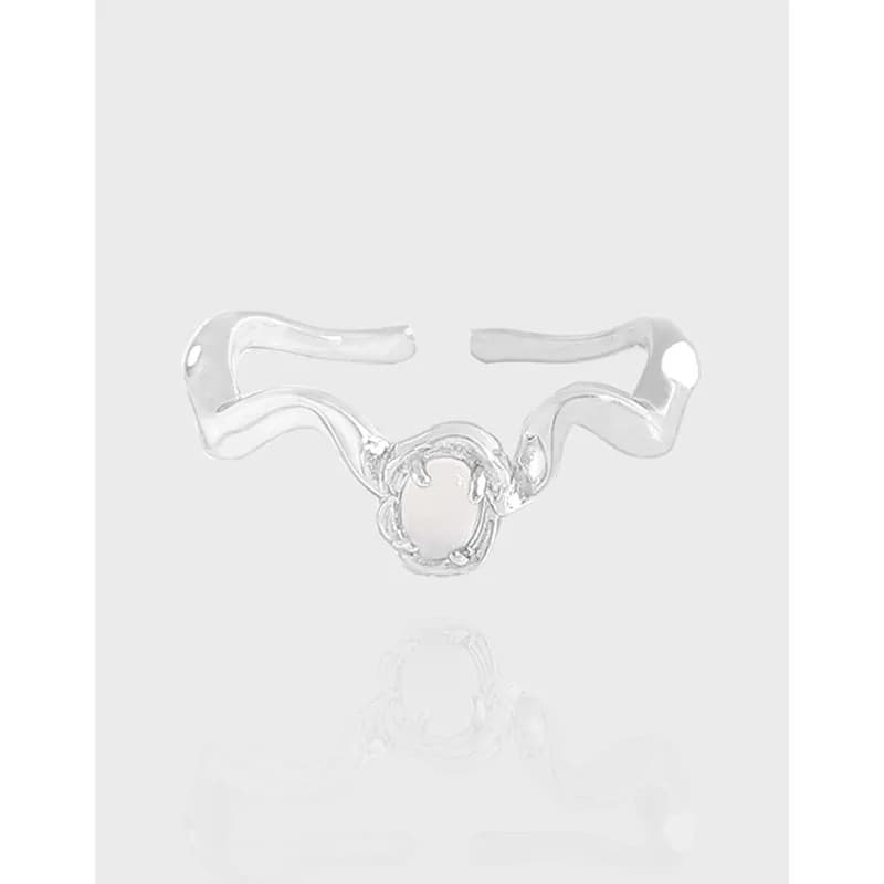 Polished sterling silver open-ring with flowing bands and a central circular centerpiece.