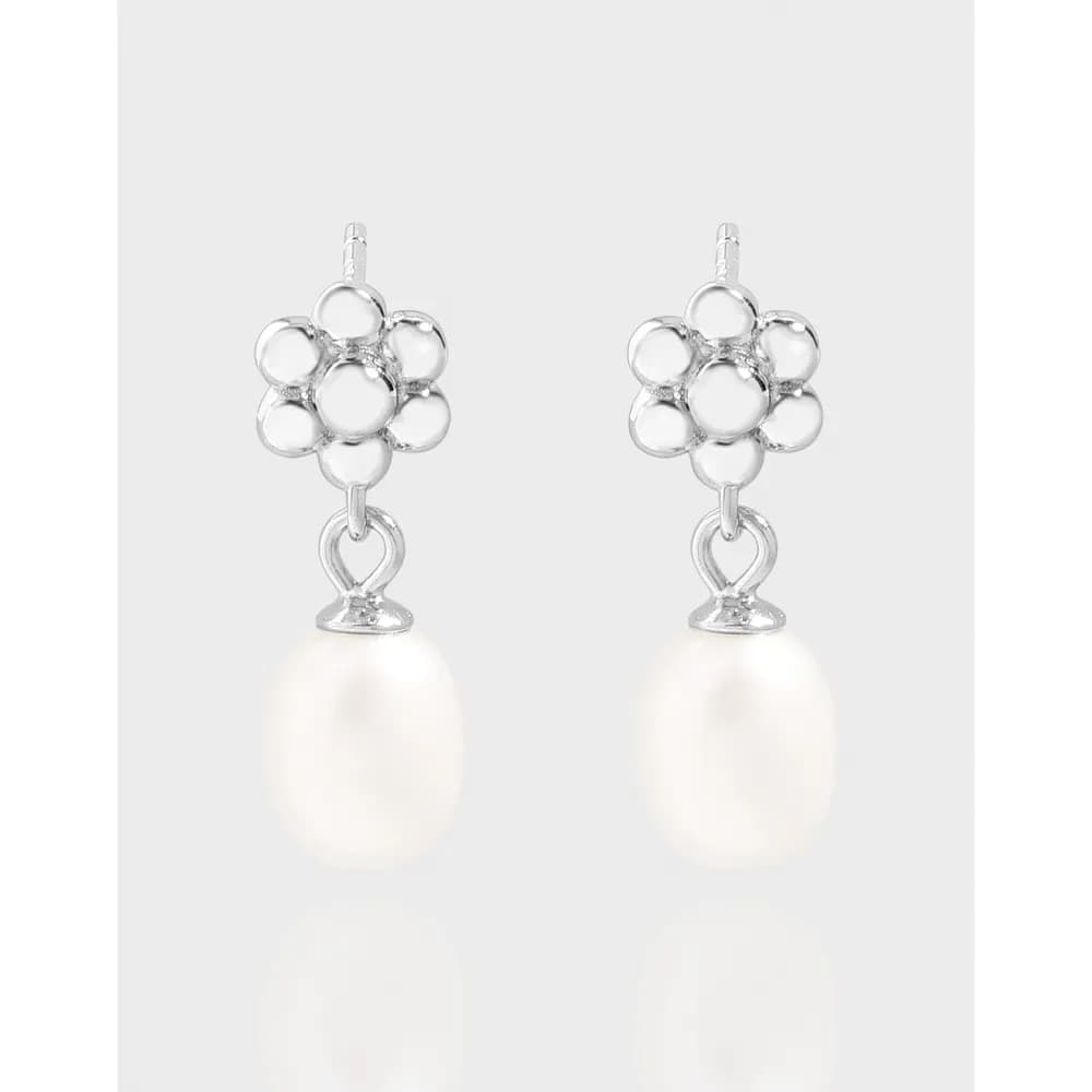 Polished sterling silver flower cluster stud with a dangling pearl drop on each earring.