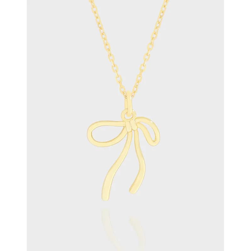 Polished bow pendant necklace on a delicate chain