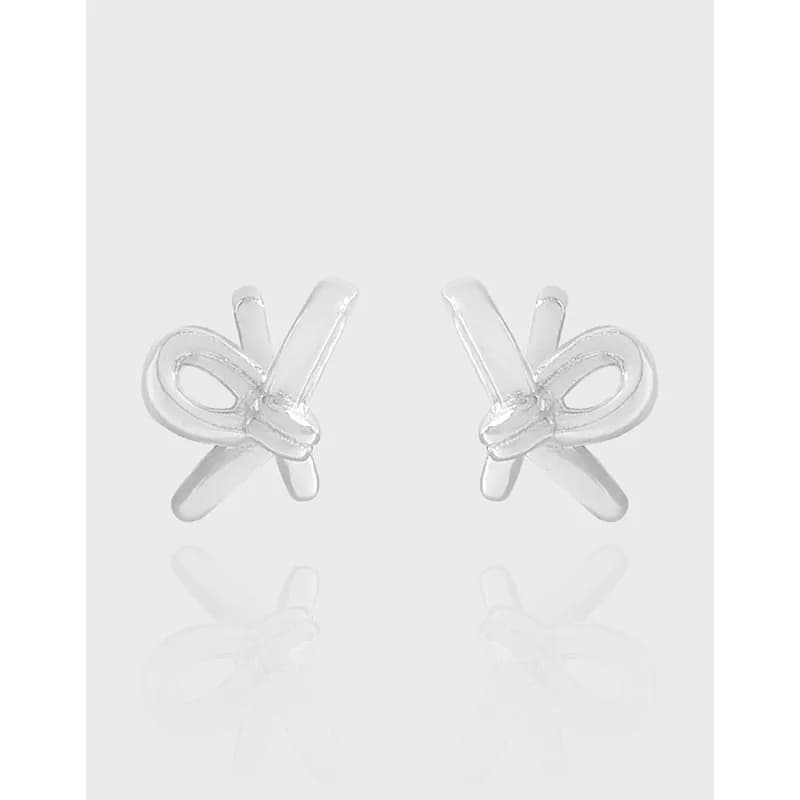 Polished sterling silver bow knot stud earrings shown head-on.