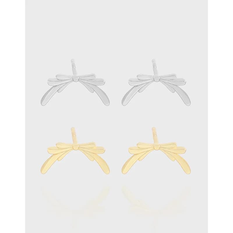 Two pairs of polished bow wing earrings, silver and gold finishes, displayed front-on.