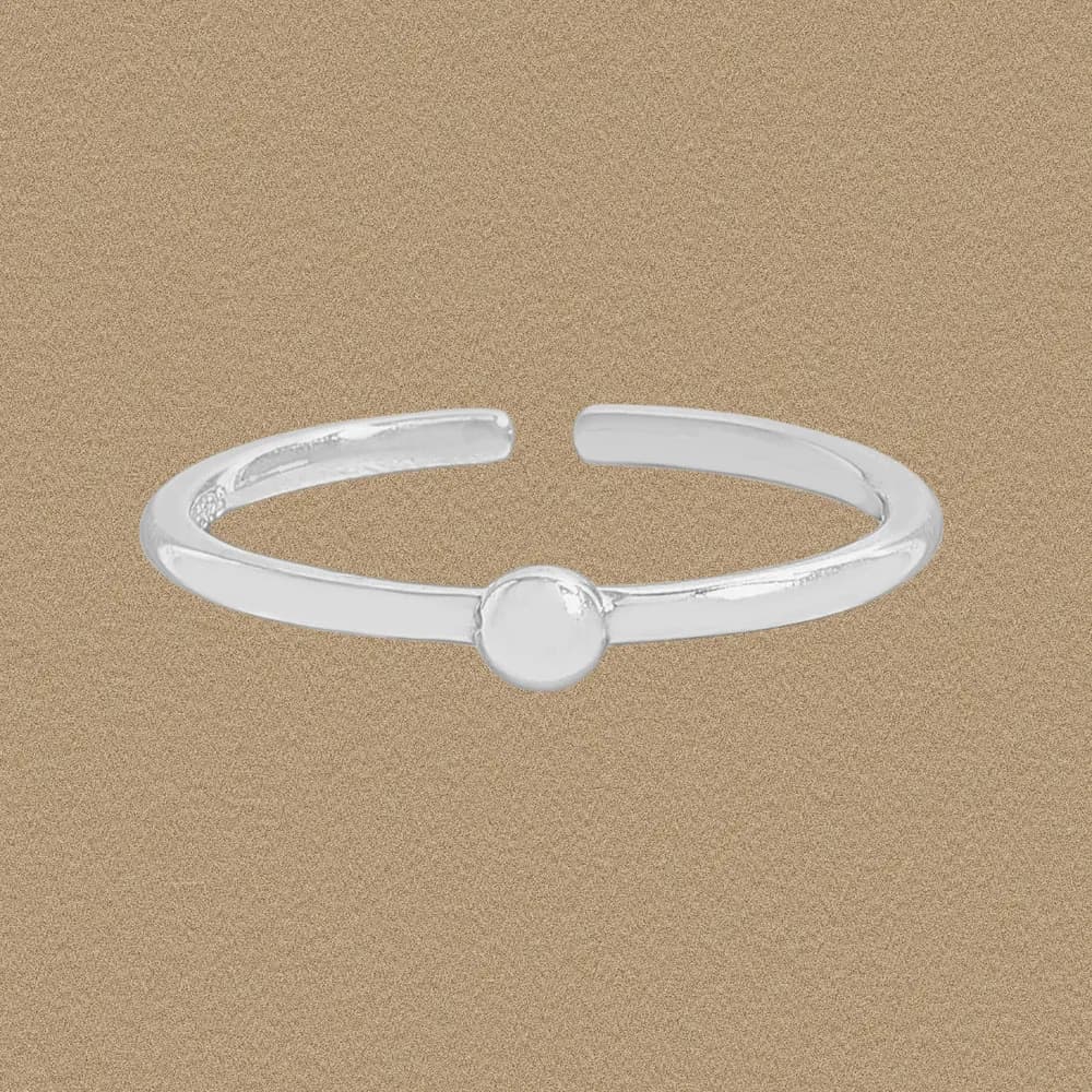 Open sterling silver ring with a single polished spherical bead at the center.