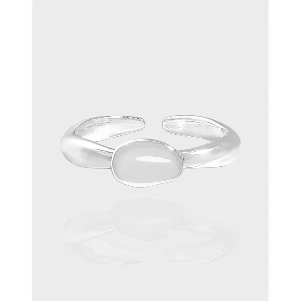 Polished sterling silver oval cabochon ring shown on an open adjustable band.