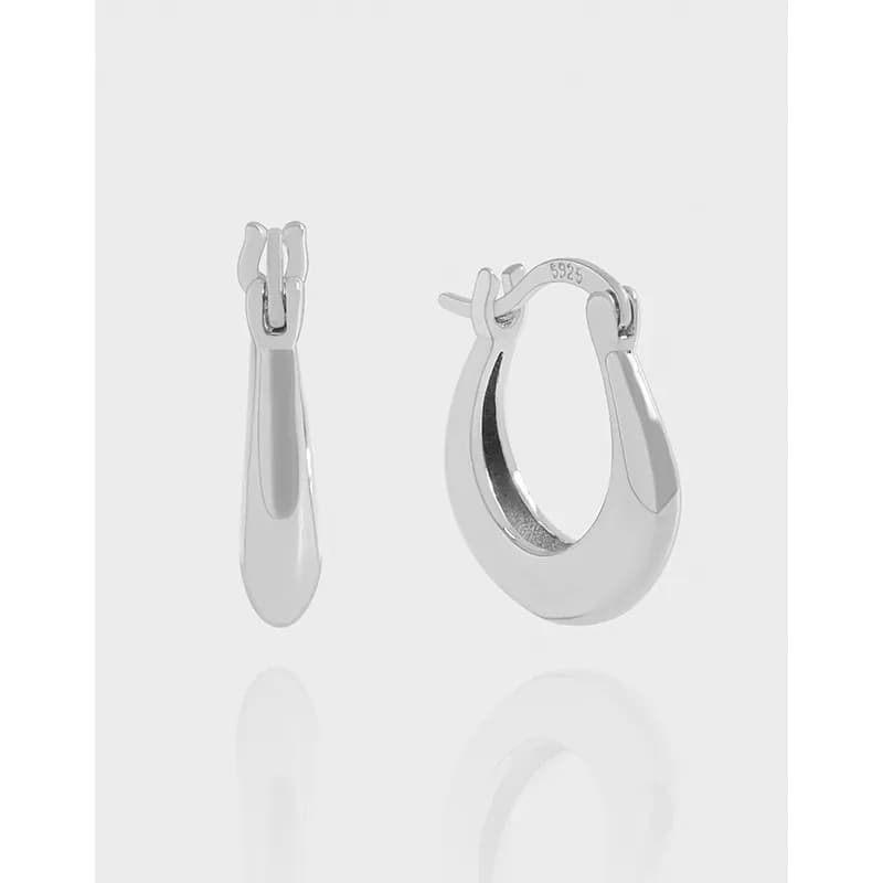 Polished curved teardrop hoop earrings in sterling silver with hinged closure.
