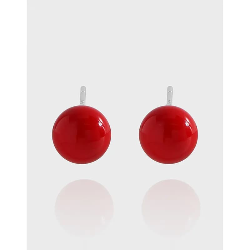 Polished sterling silver stud earrings with bright red glossy spheres