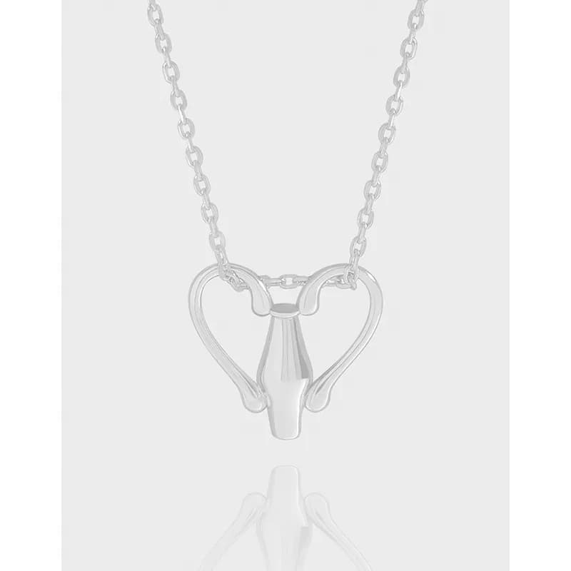 Polished sterling silver necklace with a heart-shaped pendant formed by two curved arches around a central vase-like core.