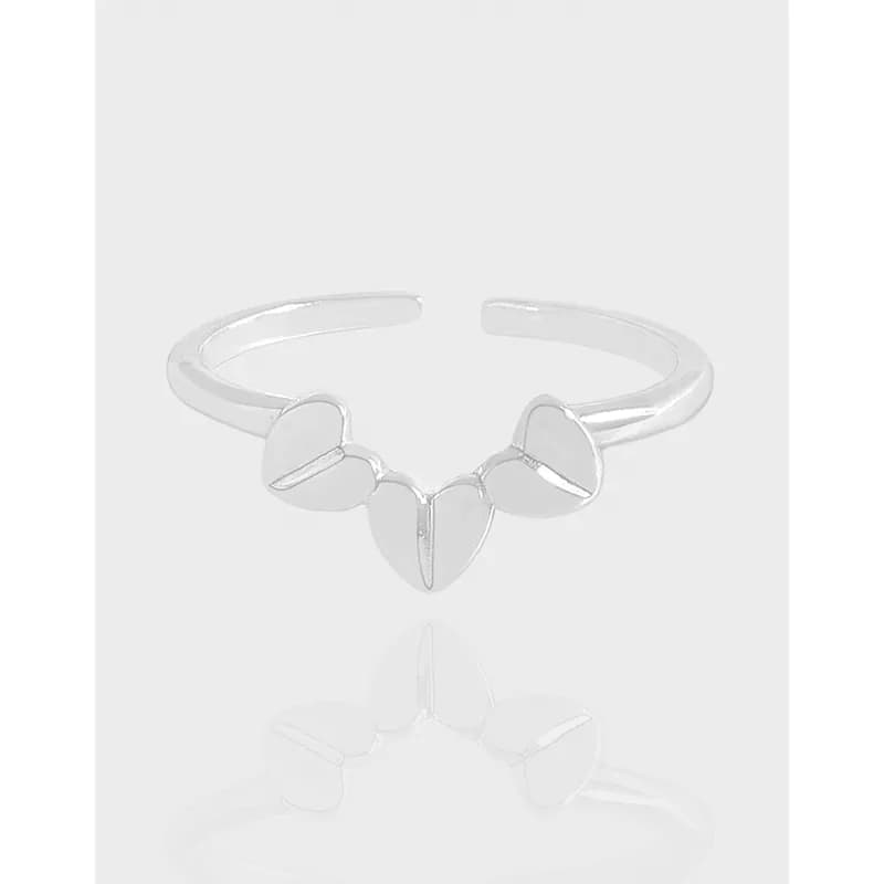 Polished sterling silver open-band ring with three petal shapes along the front.