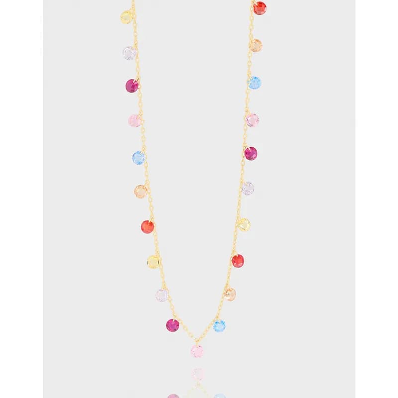 Sterling silver necklace with a gold-toned polished chain and colorful round disc beads spaced along the chain.