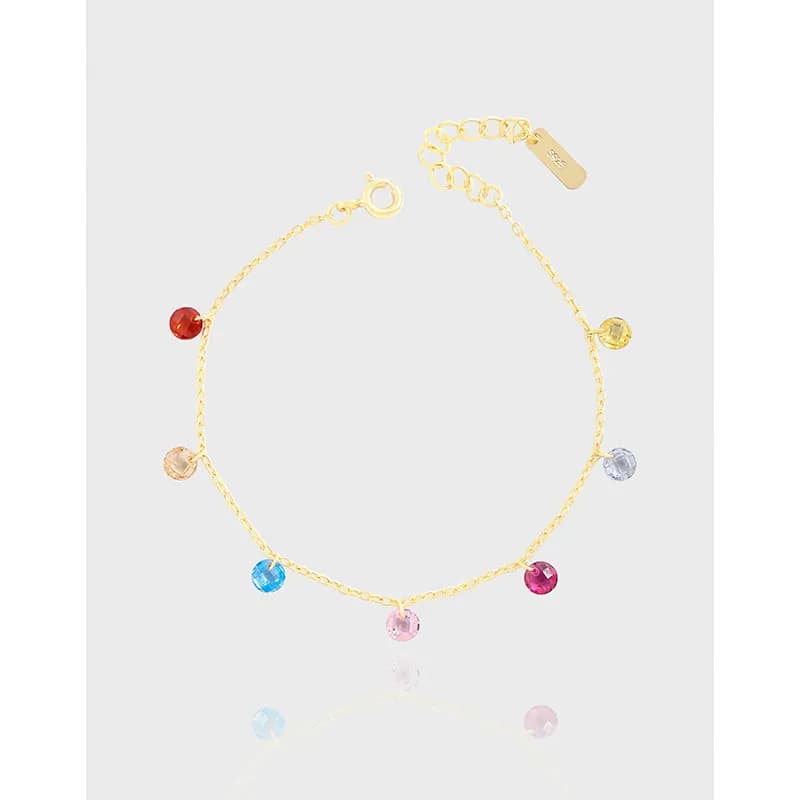 Delicate sterling silver bracelet with multicolored round beads evenly spaced along a slim chain.