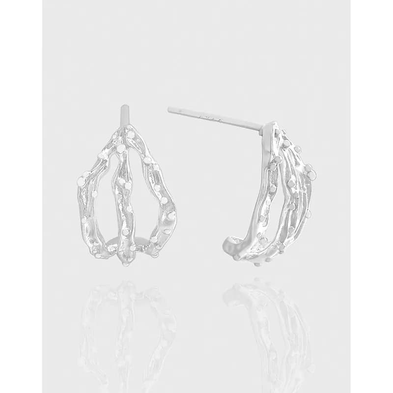 Polished sterling silver dotted loop earrings with an open teardrop silhouette and post backs.