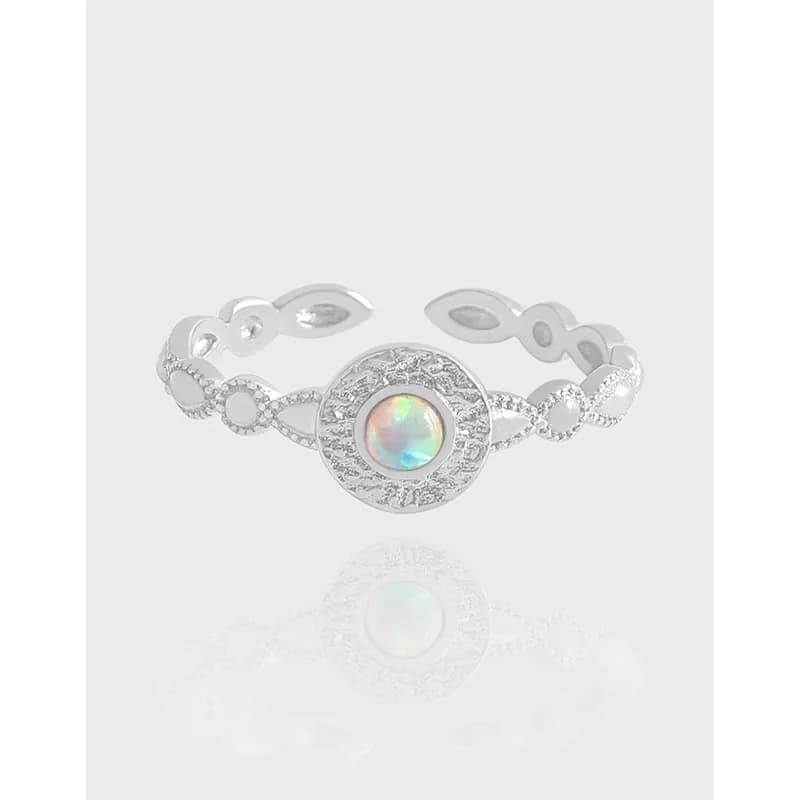 Polished sterling silver Opal Halo Ring with a textured circular centerpiece