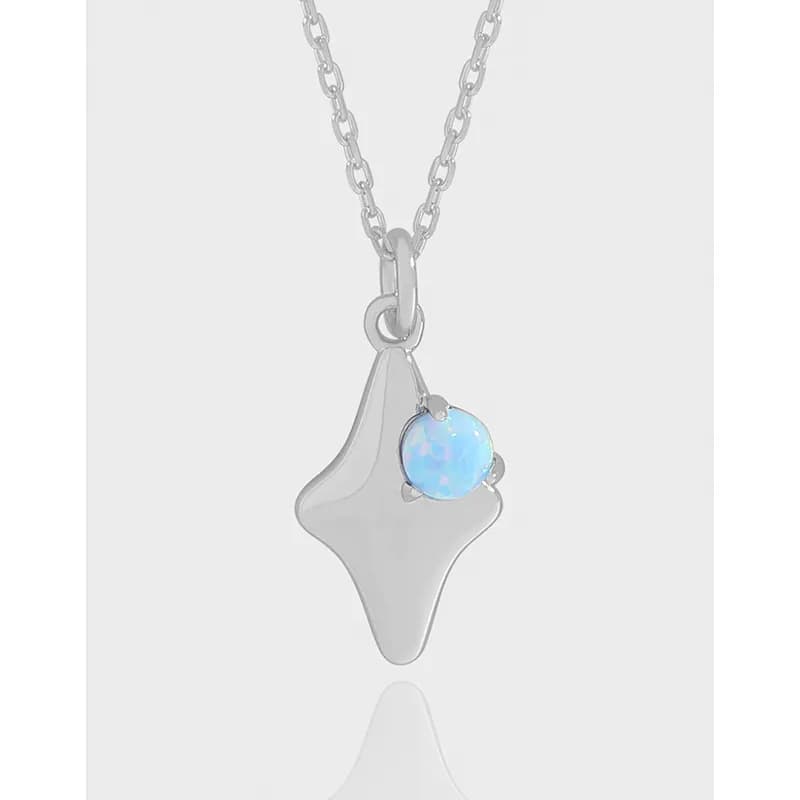 Polished sterling silver necklace with a smooth shield-shaped pendant and a round opal accent on the side.