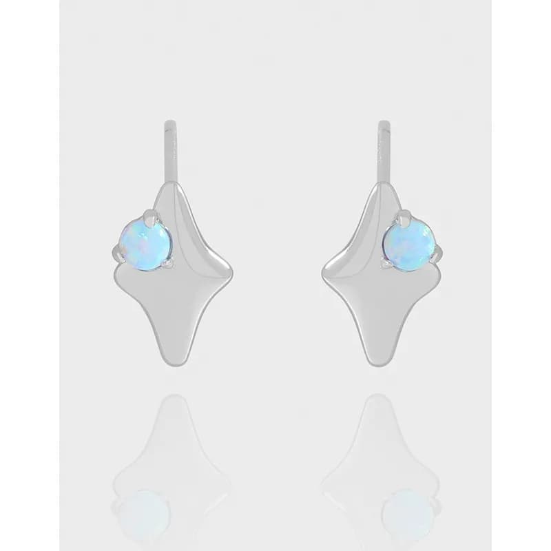 Polished sterling silver earrings with irregular sculptural drops and blue opal accents.