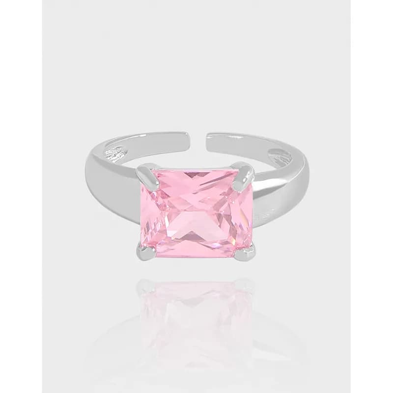 Sterling silver adjustable ring featuring a square pink princess-cut stone held by four prongs.