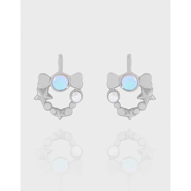 Polished sterling silver earrings with iridescent circular centerpiece and star-bead arc