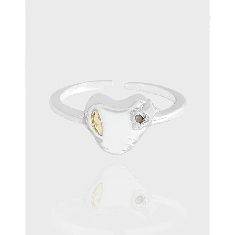 Polished sterling silver ring with a heart-shaped face and two decorative accents on either side.