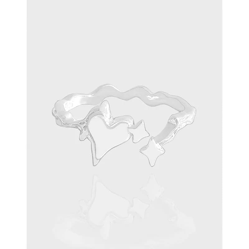 Polished sterling silver ring with a wavy band featuring heart and star cutouts