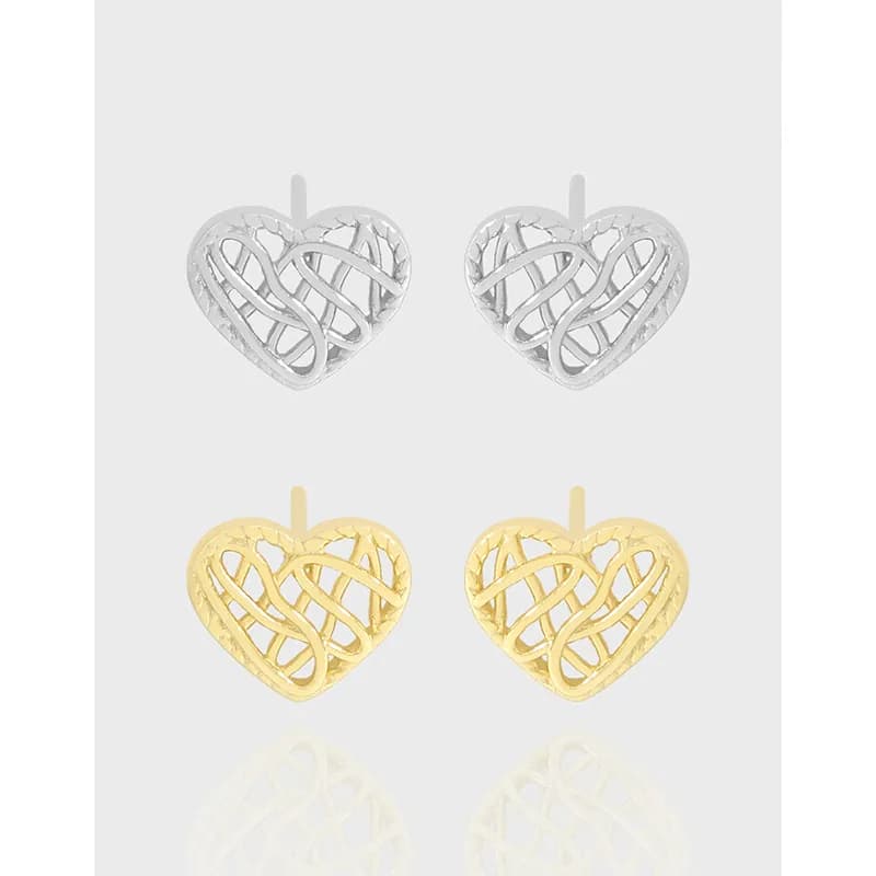 Polished sterling silver heart-lattice earrings with intricate openwork and a post back.